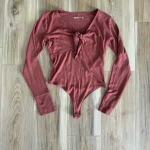 Women's Long Sleeve Tie Front Bodysuit - Rust